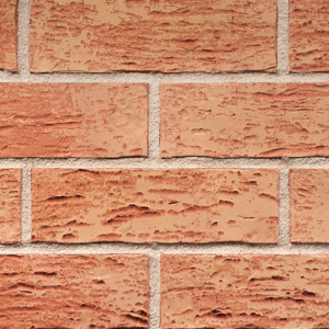Warm red textured brick slips. Zoomed in to show the detail.