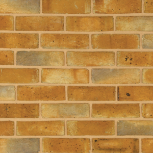 Berkeley Weathered Yellow handmade brick slips shown in a wall. The bricks have subtle colour variations and soft creases on the faces.