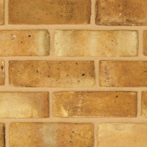 Berkeley Yellow handmade brick slips shown in a wall. The bricks have subtle colour variations and soft creases on the faces. Zoomed in to show the detail.