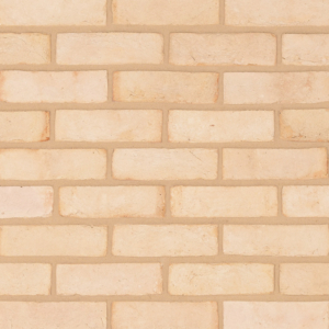 Kentwell White brick slips shown in a wall. The brick slips are a chalky soft white with pink and cream undertones.